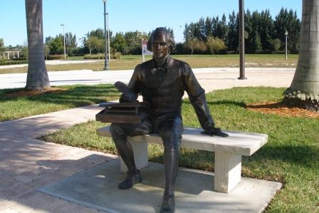 Statute of Thomas Jefferson sitting on stone bench